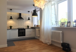 Mieszkanie w Warszawie na Mokotowie, salon z kuchnią.